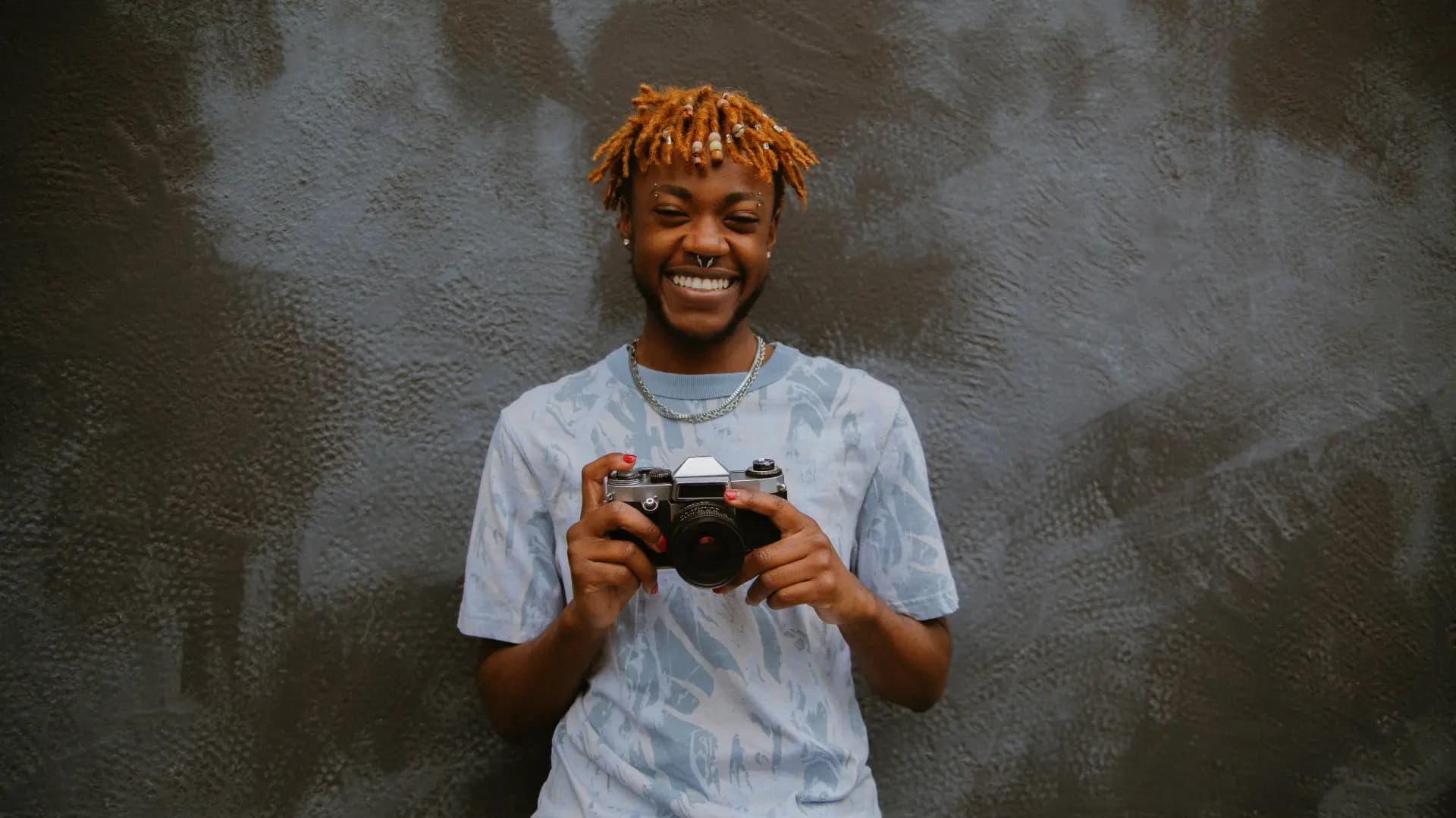 A person viewing a piece of art that represents growth and transformation.