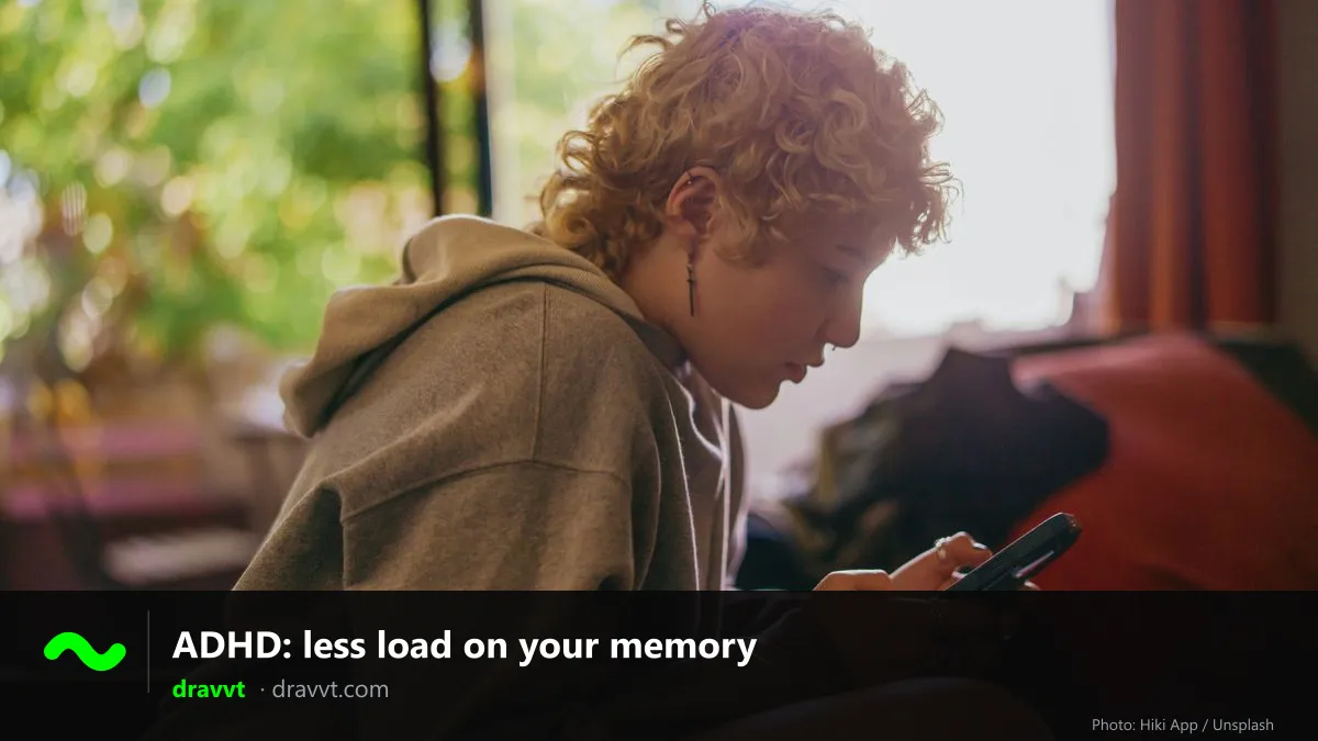 A young person with curly hair, focused on reading on their phone by a window, with the title “ADHD: less load on your memory” and the dravvt logo
