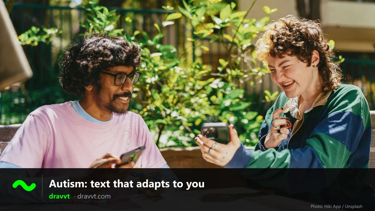 Two smiling people at an outdoor table with their phones, with the title “Autism: text that adapts to you” and the dravvt logo